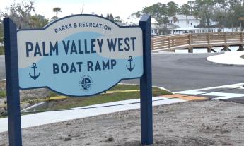 The blue and white Palm Valley boat ramp sign
