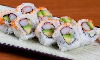 A sushi roll with crab, avocado, and cucumber served at the restaurant
