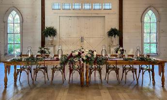 The head table settings at Chandler Oaks Barn wedding venue in St. Augustine, FL.