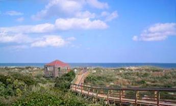 Saint Augustine Beach Vacation Rentals boardwalk to the ocean.