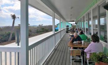 Dining on the deck with a view of the Matanzas at Commander's Shellfish Camp in St. Augustine.