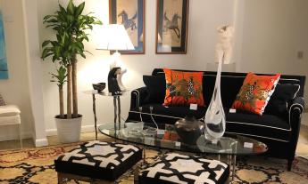 A living room setting in black, white, and red from ETC Furniture & Art in St. Augustine.