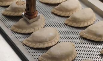 Empanadas being "branded" at Pampa St. Augustine at the Westgate Plaza in St. Augustine.