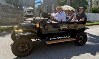 A family of 5 enjoying a tour in a "Model-T" with Pastime Tours in St. Augustine.