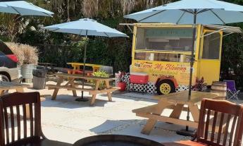 Outside seating and umbrellas in front of Taco My Blessing in St. Augustine 