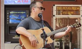 Smokin' Joe Schauer playing guitar in St. Augustine