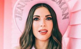 Singer songwriter Jenny Tolman in pink hat.