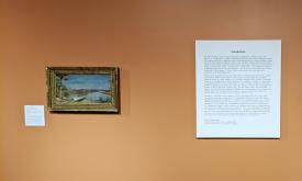 A work of art and the plaque describing the collection presented