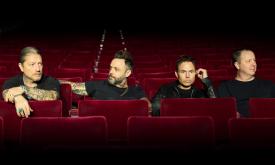 Blue October poses in a movie theatre