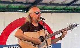 Kilo on stage with is guitar