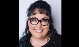 Pianist Aaron Decicco smiling at the camera