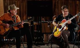 Bruce Forman and Pat Bergeson on stage playing guitars
