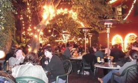 The outdoor patio at Harry's Seafood offers Nights of Lights atmosphere with hot meals.