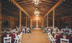 The reception area inside the barn at Kelly Farm Events. Photography by Southern Palms Studio.