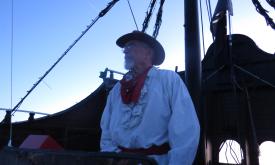 Captain Blackheart surveying the fleet during the Regatta of Lights in St. Augustine.