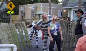Runners "escape" from the Old Jail at this fun Halloween event in St. Augustine.