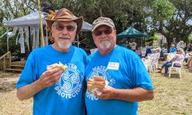 Two volunteers at Lullaby of the Rivers Festival in St. Augustine.