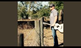 Brandon Adams performing his own song, "Long-Haired Shrimp Boat Hippie." 