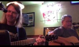 "Volcano" by Jimmy Buffet, performed by Committee Lite AKA Brewer and Miller.