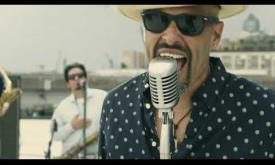 LPT performing "Los Bravos" in the official video