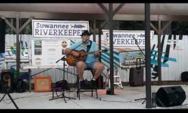 Sweet William Ennis playing one of his songs, "Lonesome Cowboy"