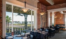 Interior view of A1A Ale Works dining room, with a view to the bayfront in St. Augustine.