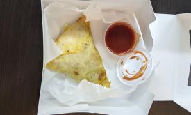 An empanada with hot sauce from Ancient City Brunch Bar in St. Augustine.