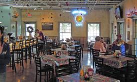 The Florida Cracker Café offers a contemporary indoor dining area as well as a garden patio with outdoor seating.