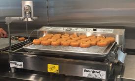 Warm, fresh donuts right off the conveyor belt.