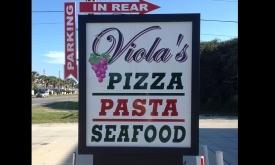 The sign for Viola's Pizza Pasta and Seafood in St. Augustine, FL