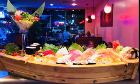 A Sushi Boat and the interior of Baitong Thai Sushi Restaurant in St. Augustine.