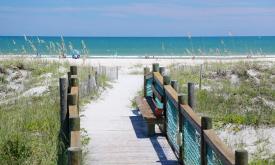 A private boardwalk leads from St. Augusitne's La Fiesta Ocean Inn & Suites to the beach.