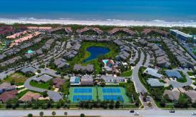 Aerial view of the tennis courts and resort at Ocean Gallery Resort in St. Augustine Beach, Florida