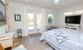 Large bedrooms with TVs and exterior doors to enjoy the outside view