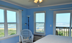 Bright bedrooms with ocean views at the Saint Augustine Beach House 