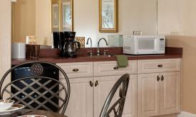 The wet bar at Harbor 26 includes a mini refrigerator, microwave, coffee maker, and sink.
