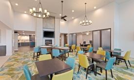 The seating area off the lobby lets friends gather, and is a great place to enjoy breakfast at the Homewood Suites in St. Augustine.