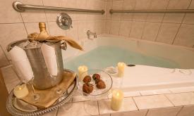 A romance package next to one of Agustin Inn's whirlpool tubs.