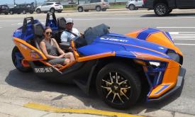 These visitors are driving along the bayfront in a Polaris Slingshot from Ancient City Slingshots in St. Augustine.