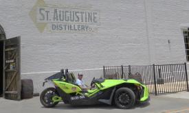 Ready to visit the St. Augustine Distillery, this visitor is touring in a fun vacation vehicle from Ancient City Slingshot.