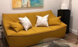 A gold sofa with clean lines at ETC Furniture & Art in St. Augustine.