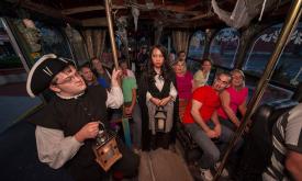 Guests board the “Trolley of the Doomed” to experience the darker side of St. Augustine on the award-winning Ghosts & Gravestones tour.