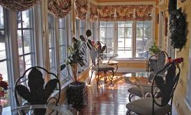 Beautiful bed and breakfast that includes a great sun room to enjoy breakfast in.