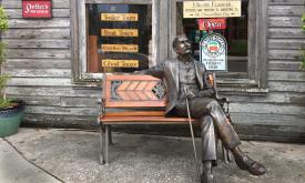 A statue of Henry Flagler relaxes on a bench outside Potter's Wax Museum.