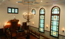 The sanctuary, bimah, and stained-glass windows in the First Congregation Sons of Israel in St. Augustine.