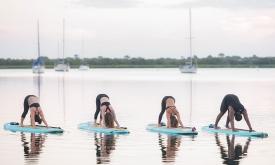 This yoga studio anchors itself in an open space on paddle boards.