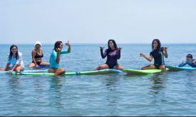 girls on boards at surf school