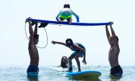 kids playing surf limbo at surf camp 