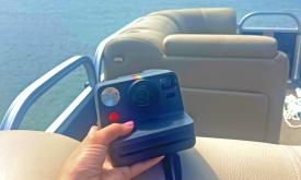 A Polaroid Camera lets visitors take photos of their day on the water with a Wake2Wake pontoon boat rental in St. Augustine.