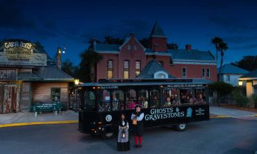 Ghost and Gravestones haunted trolley in front of the Old Jail